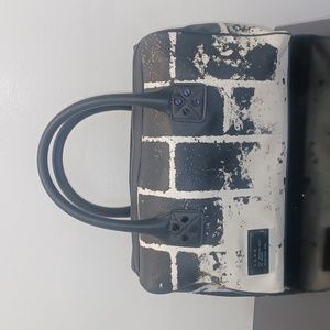 L.A.M.B. black and white satchel bag by Gwen Stefani.